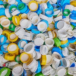 Pile of bottle tops from plastic drink bottles