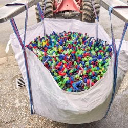 Heavy Duty bag with loads of used Shotgun Cartridges being carried by a forklift