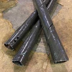 Three plastic spiral tree guards laying on the floor